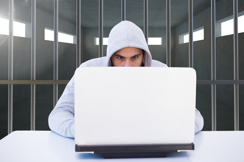 Image of a computer user in jail because of violating the proposed TikTok ban bill. AKA the RESTRICT act.